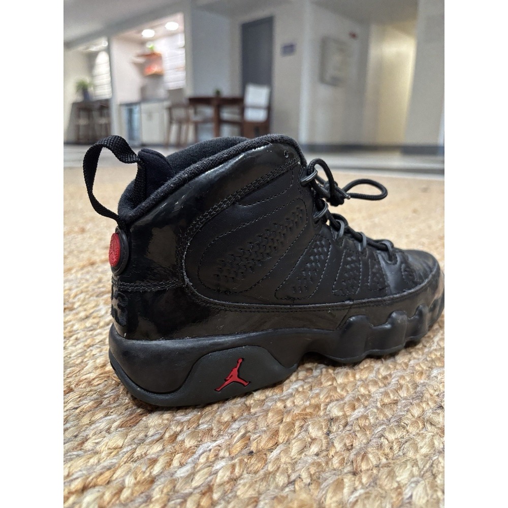 Size 6Y pre owned pair of black Air Jordan 9 Retro Bred No Box